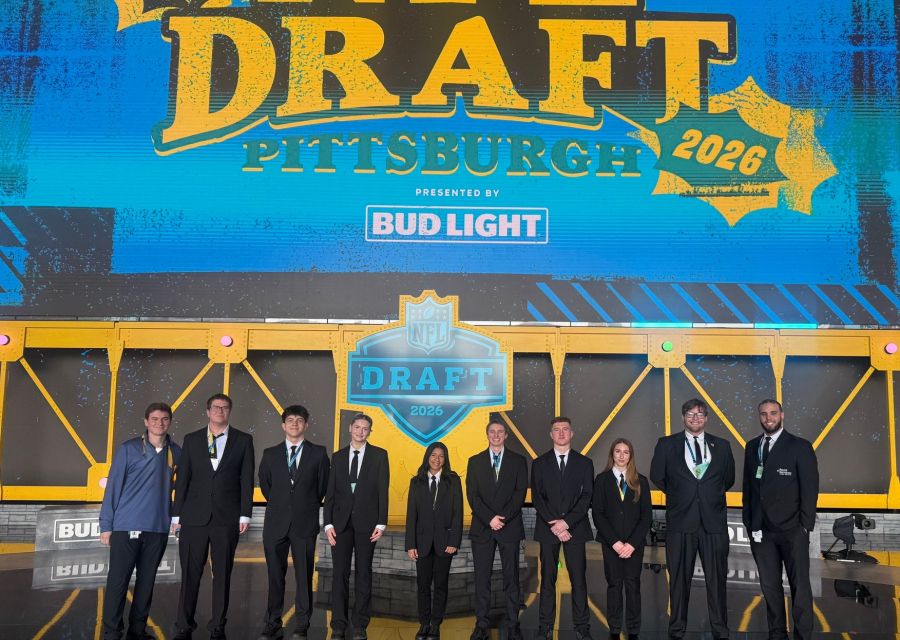 Group photo of sport management students on stage at the NFL Draft 