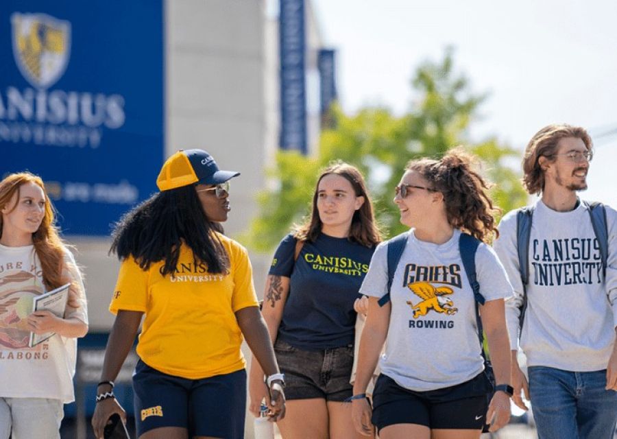 Group shot of canisius university students walking on campus 