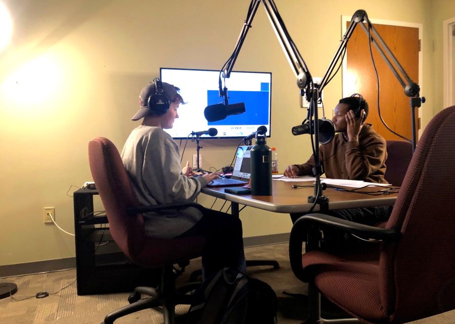 Grace Coloney and Daunte Briggs recording in the podcast studio.