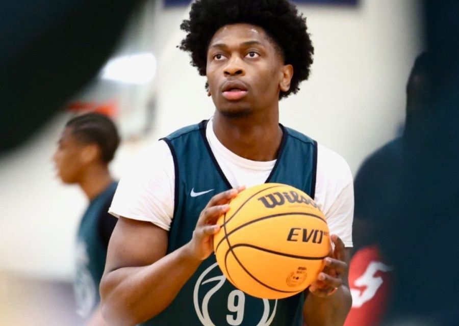 Men's basketball player dribbling a basketball. 