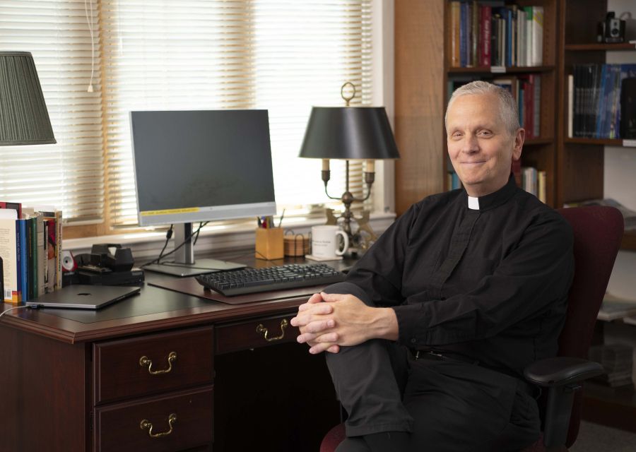 Rev. Robert Reiser, SJ, Seated