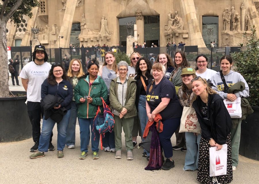 A group of students standing in front of a church.