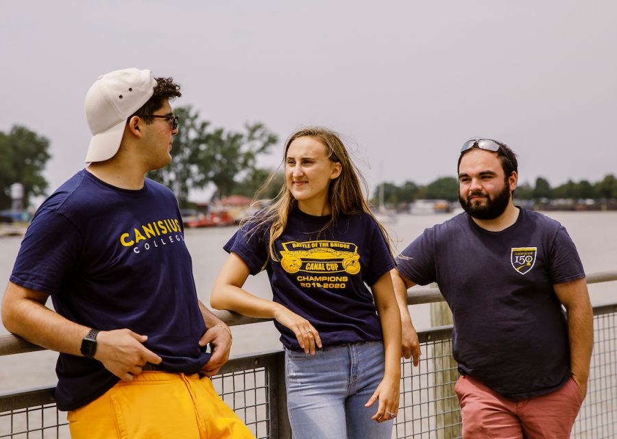 Three people standing outside