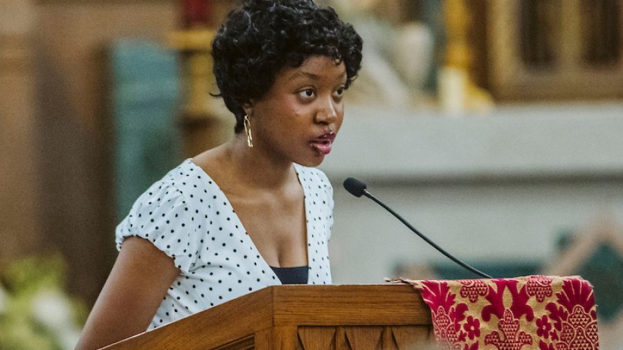Canisius student reads scripture during Mass of the Holy Spirit 