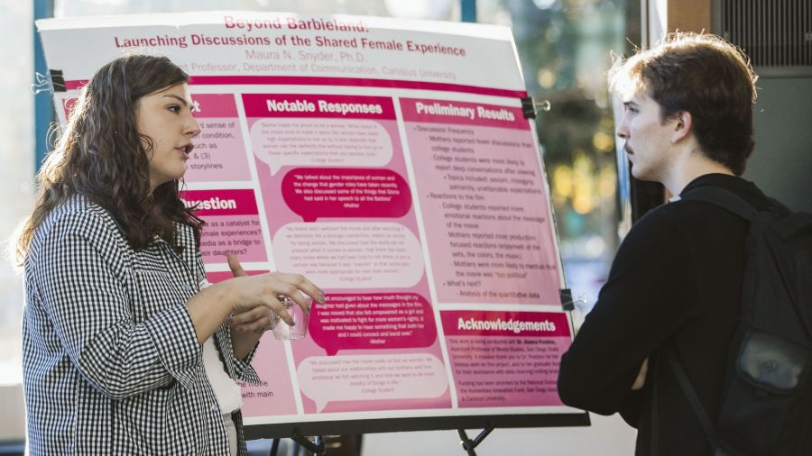 Dr. Maura Snyder speaks with a guest at the event.
