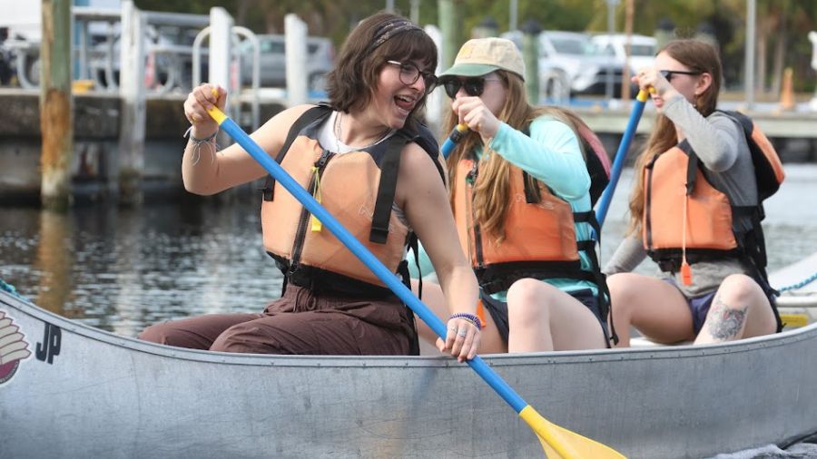Three people in a canoe. 
