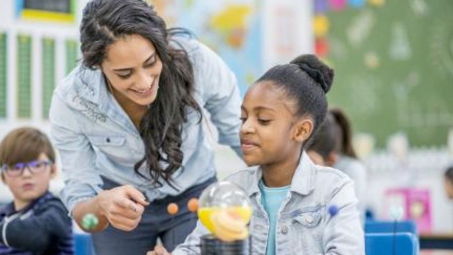 Student teacher in elementary ed classroom 
