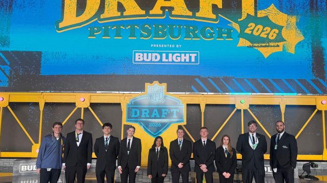 Group photo of sport management students on stage at the NFL Draft 