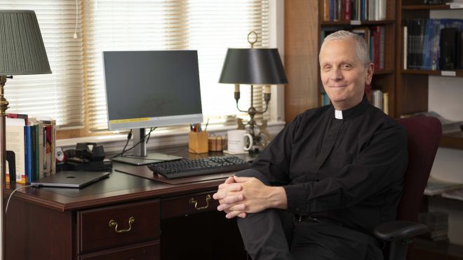 Rev. Robert Reiser, SJ, Seated