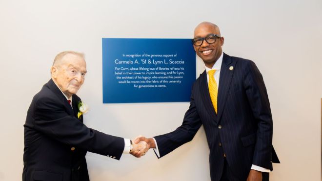 President Stoute shakes hands with Carmello Scaccia at dedication ceremony in Golisano Center for Student Success 