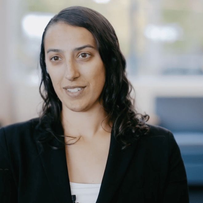 Student in business suit in a college conference area