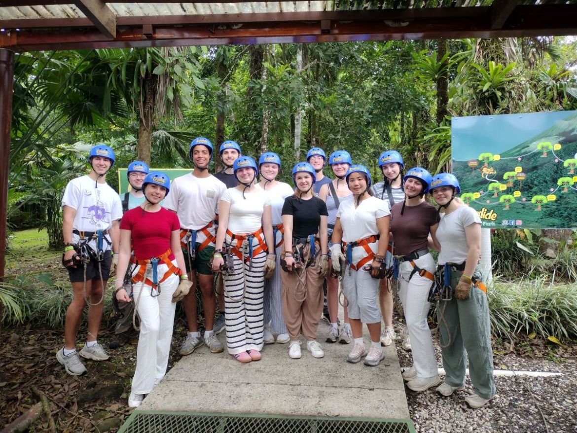 Students standing before zipline experience
