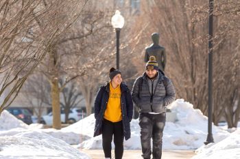 Students walking in quad in winter