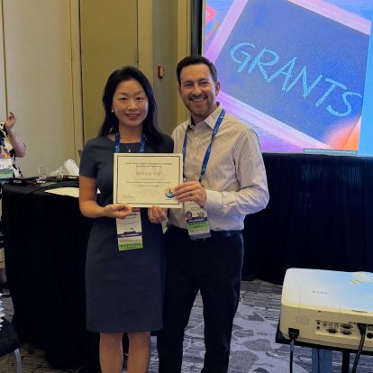 David Moran, PhD, presenting awards at Counselor Education Conference