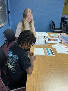 Elizabeth Andews reads with a student.