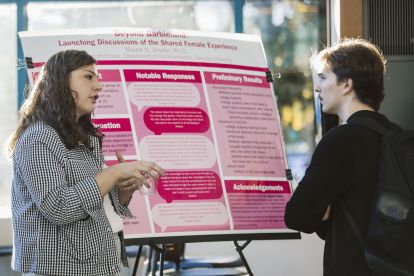 Dr. Maura Snyder speaks with a guest at the event.
