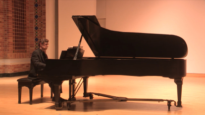 faculty playing piano