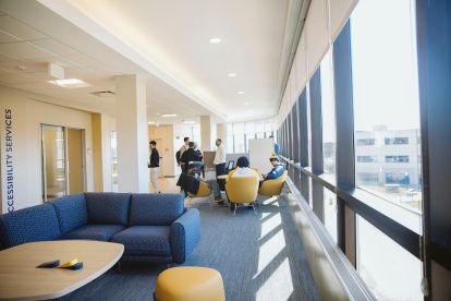 Students sitting in a lounge area.