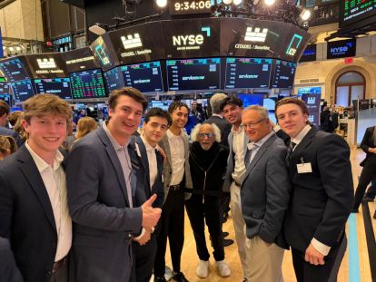 Group of students on trading floor.