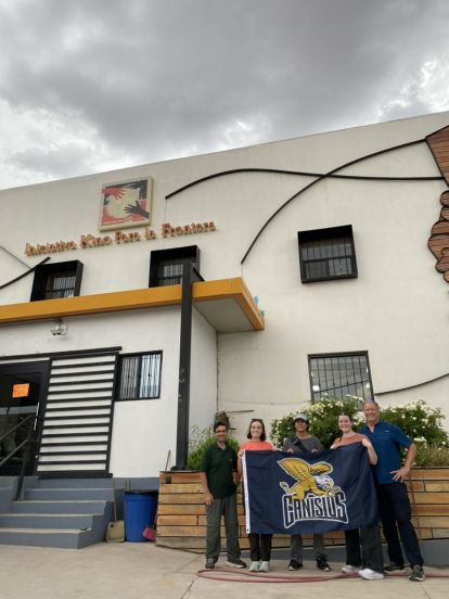 Students stand in front of the Kino Border Initiative in Sonora, Mexico