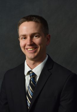 Professional headshot of Dr. Adam Booth